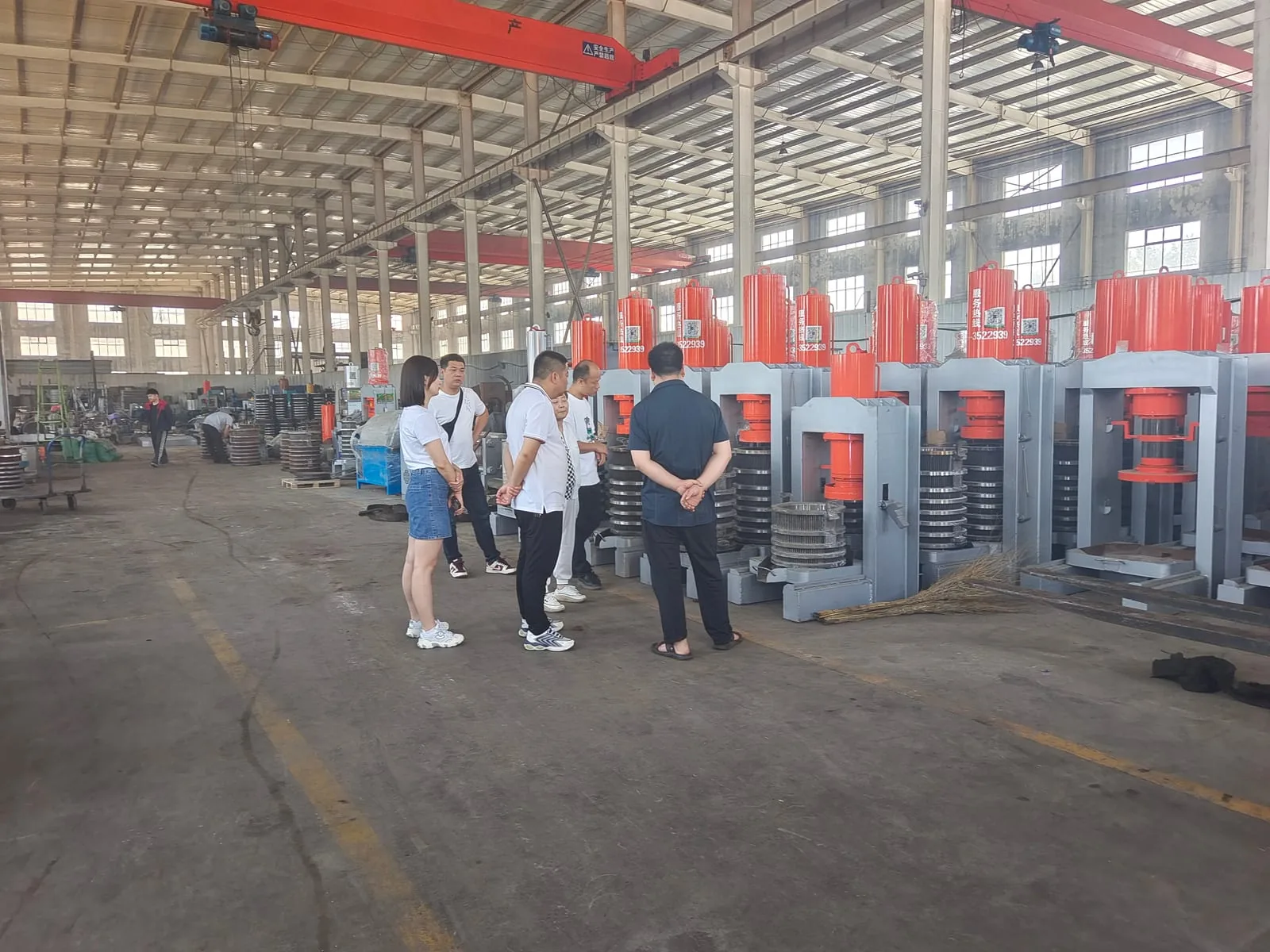 Overseas buyers inspecting presses in the workshop